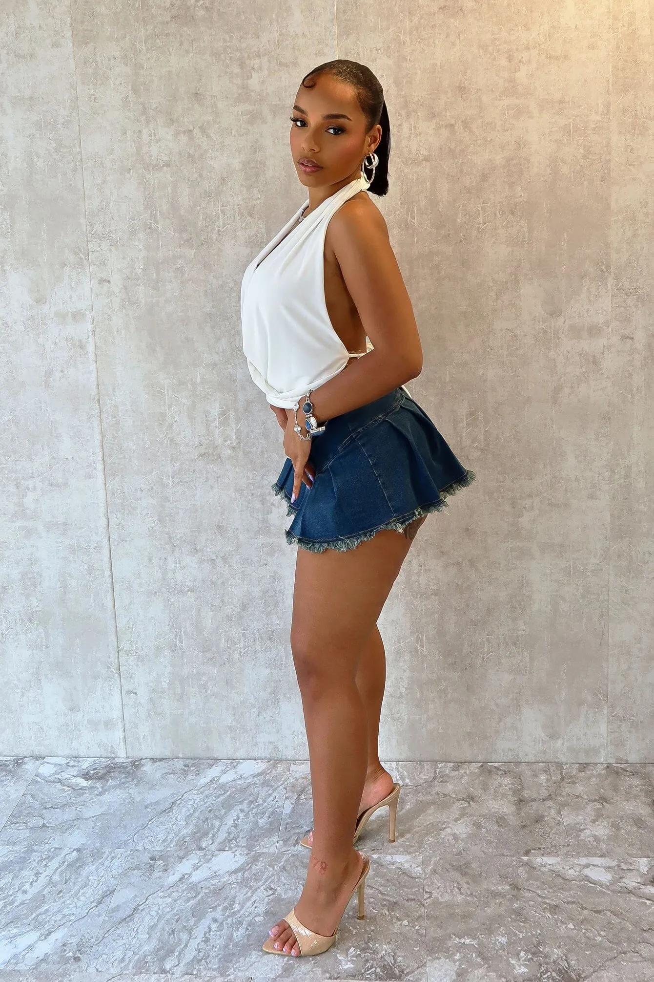 Margot Low Rise Pleated Denim Micro Skirt Modern Cut fashion industry